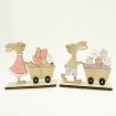 Sweet rabbit with wagon and flowers made of wood on a stand